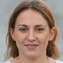 Joyful white adult female with medium  brown hair and grey eyes