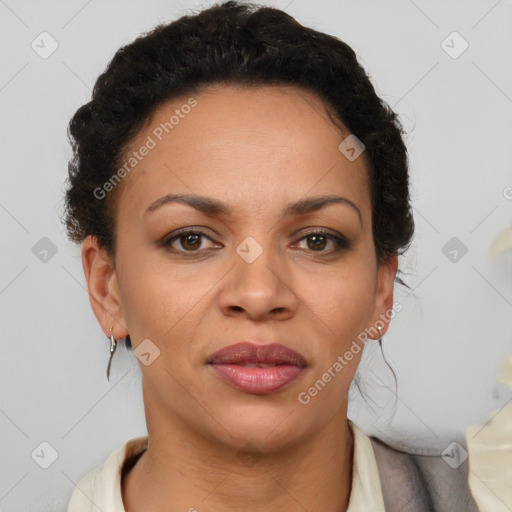 Joyful black adult female with short  brown hair and brown eyes