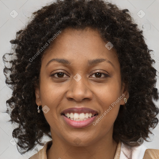 Joyful black young-adult female with medium  brown hair and brown eyes