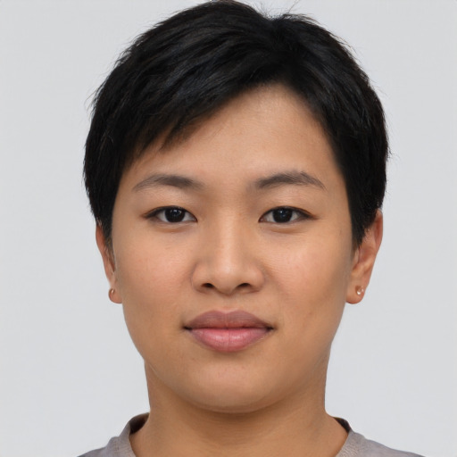 Joyful asian young-adult female with short  black hair and brown eyes