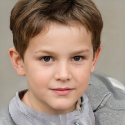 Joyful white child male with short  brown hair and brown eyes