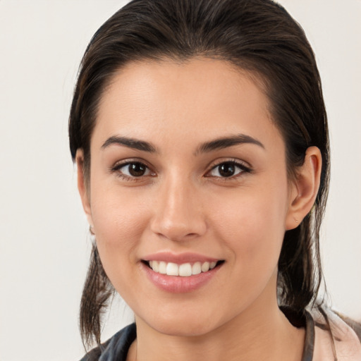 Joyful white young-adult female with medium  brown hair and brown eyes