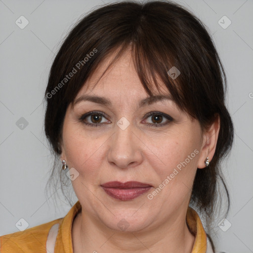 Joyful white adult female with medium  brown hair and brown eyes