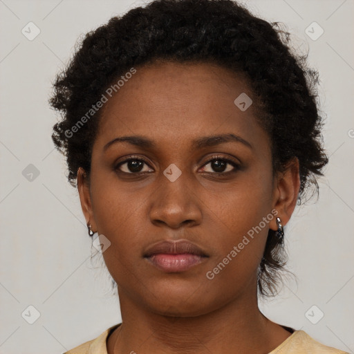 Neutral black young-adult female with short  brown hair and brown eyes