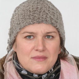 Joyful white young-adult female with medium  brown hair and blue eyes