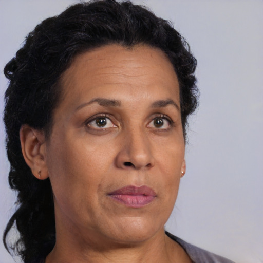 Neutral latino adult female with short  brown hair and brown eyes