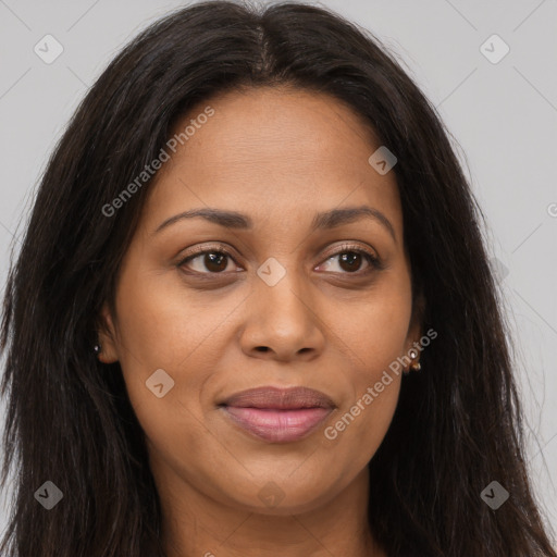 Joyful latino adult female with long  brown hair and brown eyes