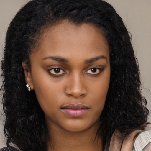 Neutral latino young-adult female with long  black hair and brown eyes