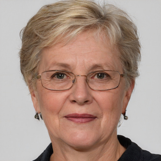 Joyful white middle-aged female with medium  brown hair and blue eyes