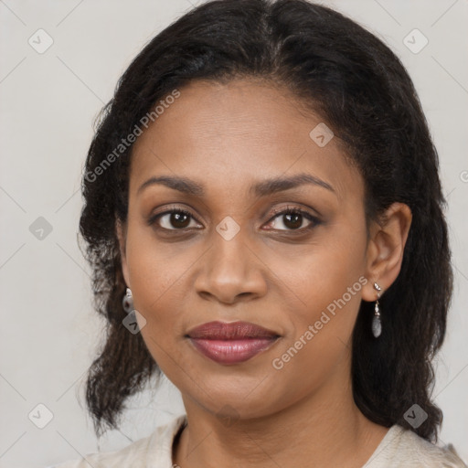 Joyful black young-adult female with medium  brown hair and brown eyes