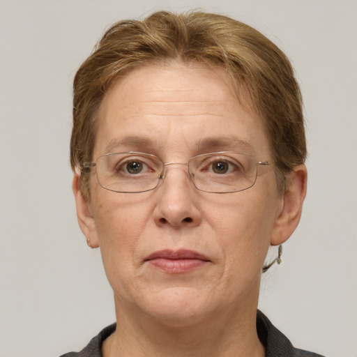 Joyful white middle-aged female with short  brown hair and grey eyes