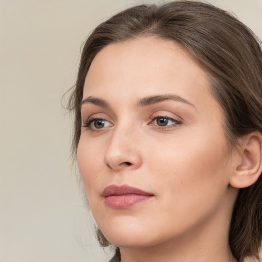 Neutral white young-adult female with medium  brown hair and grey eyes