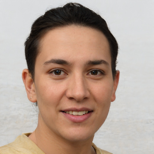 Joyful white young-adult female with short  brown hair and brown eyes