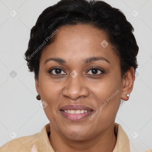 Joyful latino adult female with short  brown hair and brown eyes