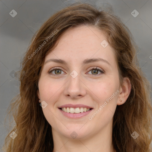 Joyful white young-adult female with long  brown hair and green eyes