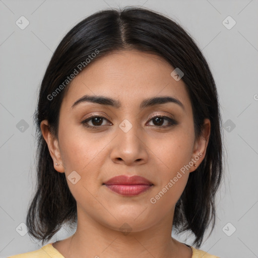 Joyful latino young-adult female with medium  brown hair and brown eyes