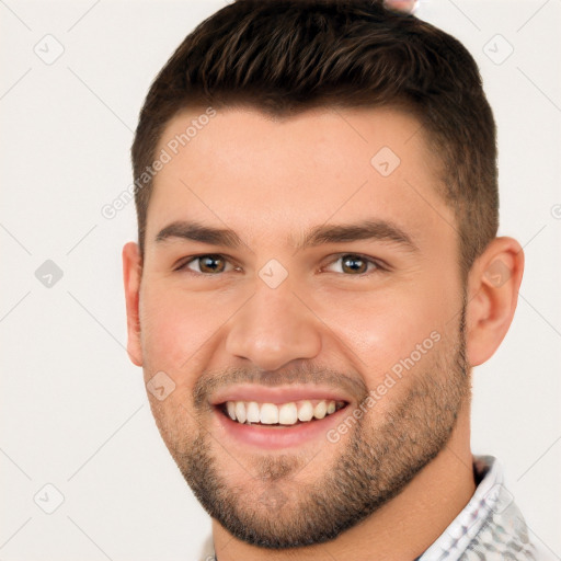 Joyful white young-adult male with short  brown hair and brown eyes