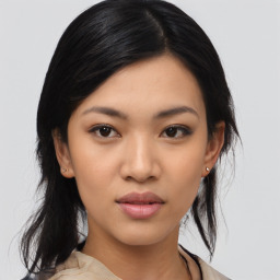 Joyful asian young-adult female with medium  black hair and brown eyes