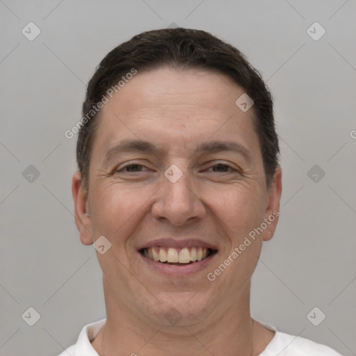 Joyful white adult male with short  brown hair and brown eyes