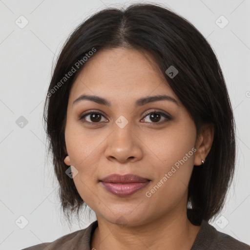 Joyful latino young-adult female with long  brown hair and brown eyes