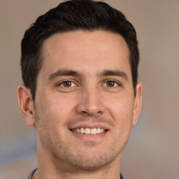 Joyful white adult male with short  brown hair and brown eyes