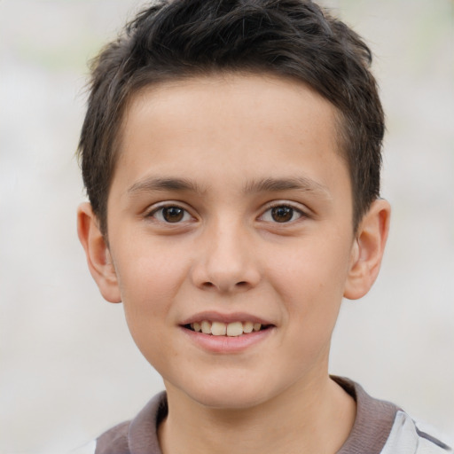 Joyful white child male with short  brown hair and brown eyes