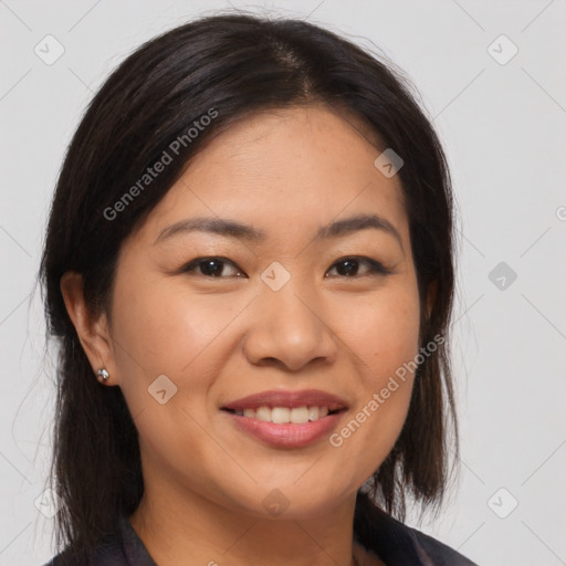 Joyful asian young-adult female with medium  brown hair and brown eyes