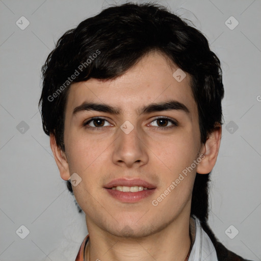 Joyful white young-adult male with short  black hair and brown eyes