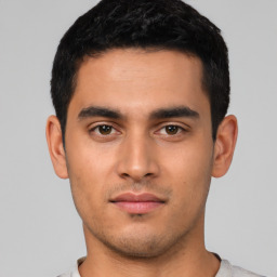 Neutral latino young-adult male with short  black hair and brown eyes