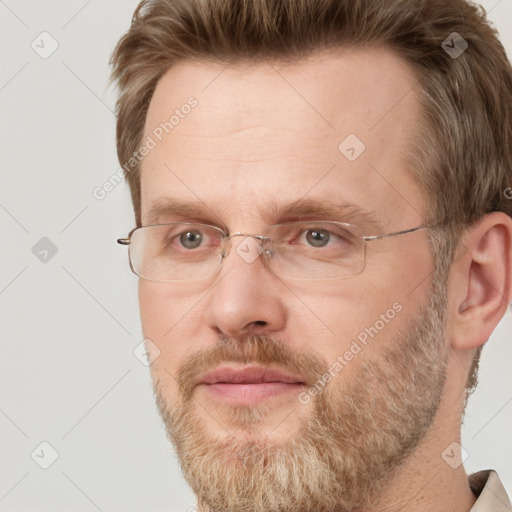 Joyful white adult male with short  brown hair and grey eyes