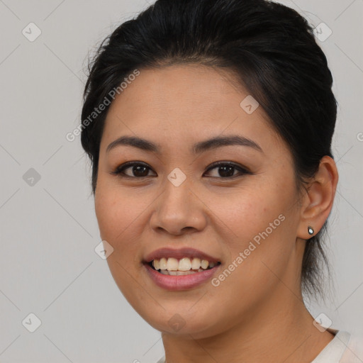 Joyful asian young-adult female with medium  brown hair and brown eyes