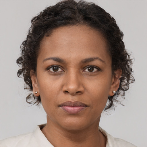 Neutral black young-adult female with short  brown hair and brown eyes