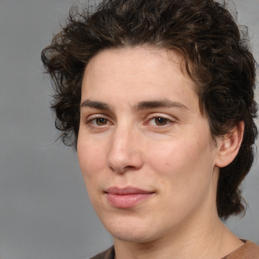 Joyful white young-adult male with medium  brown hair and brown eyes