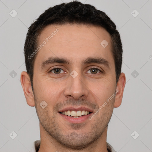 Joyful white young-adult male with short  brown hair and brown eyes