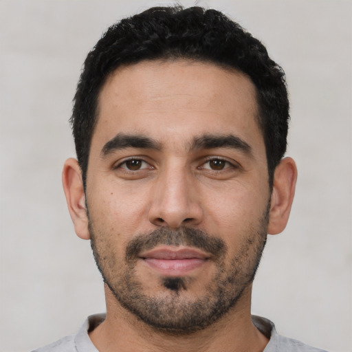 Neutral latino young-adult male with short  black hair and brown eyes
