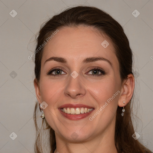 Joyful white young-adult female with long  brown hair and grey eyes