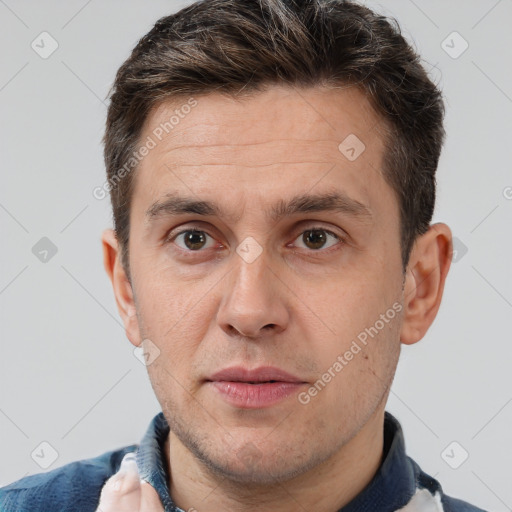 Joyful white adult male with short  brown hair and brown eyes