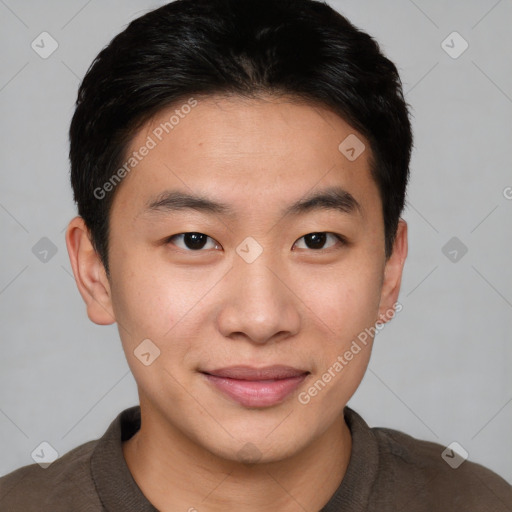 Joyful asian young-adult male with short  brown hair and brown eyes