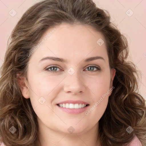 Joyful white young-adult female with long  brown hair and green eyes