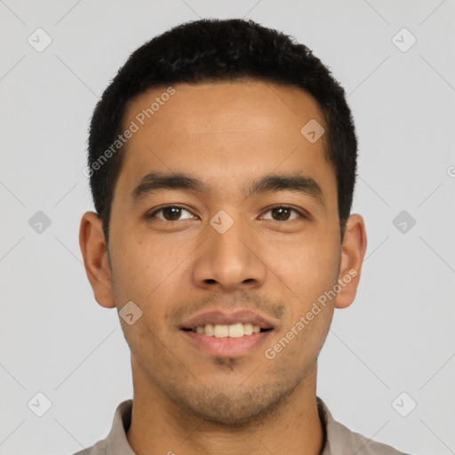 Joyful latino young-adult male with short  black hair and brown eyes