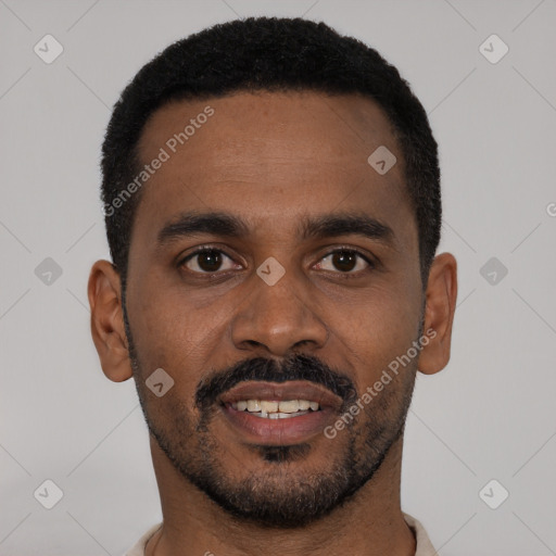 Joyful black young-adult male with short  black hair and brown eyes