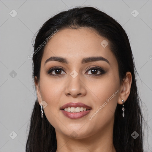 Joyful latino young-adult female with long  black hair and brown eyes