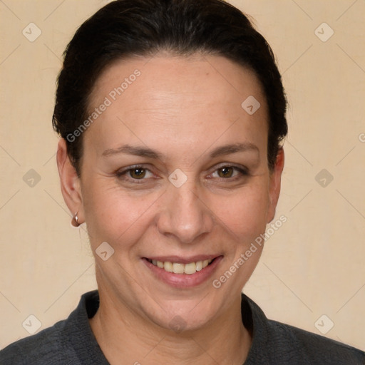 Joyful white adult female with short  brown hair and brown eyes