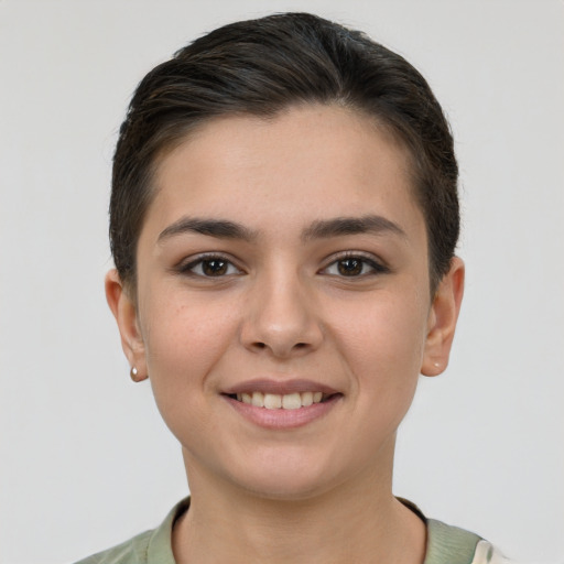 Joyful white young-adult female with short  brown hair and brown eyes