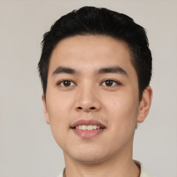 Joyful asian young-adult male with short  black hair and brown eyes