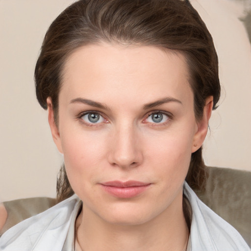 Neutral white young-adult female with short  brown hair and grey eyes