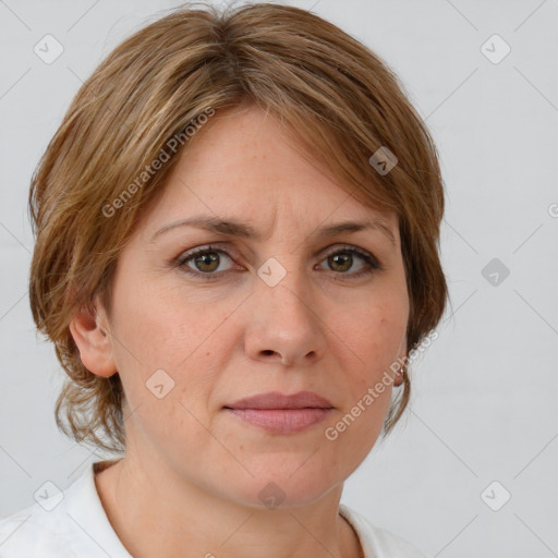 Joyful white adult female with medium  brown hair and grey eyes