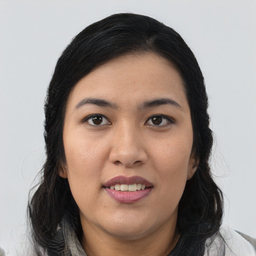 Joyful asian young-adult female with medium  black hair and brown eyes