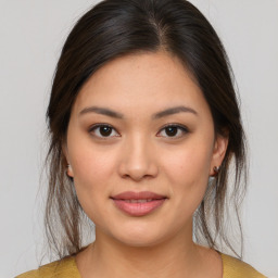 Joyful asian young-adult female with medium  brown hair and brown eyes