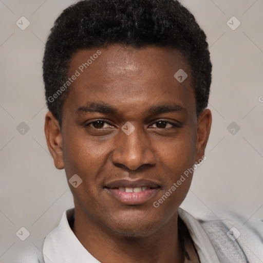 Joyful black young-adult male with short  brown hair and brown eyes